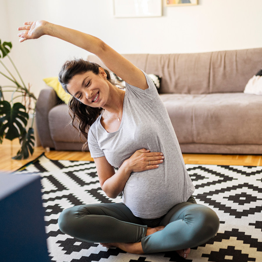  A woman practicing pelvic rocking, focusing on breathing and relaxation for core strength and stress relief